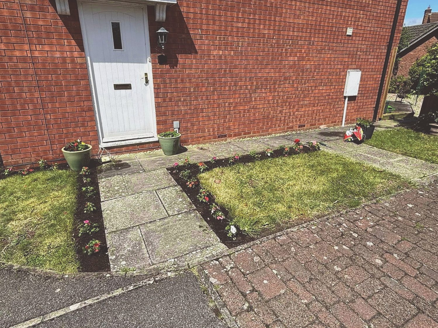 Front garden border after a tidy-up and planting