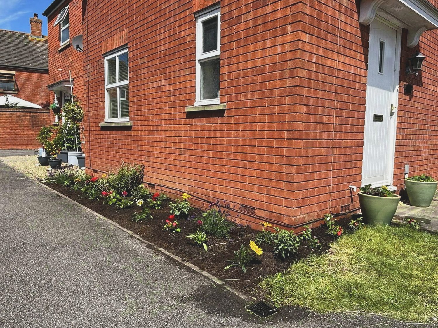 Side border after weeding, planting and a soil refresh