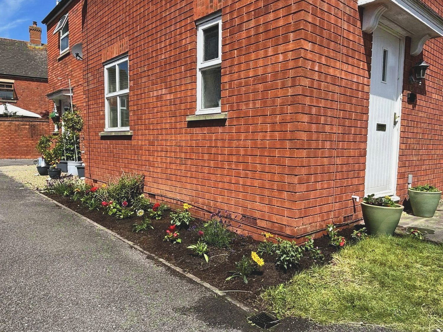 Side border after weeding, planting and a soil refresh